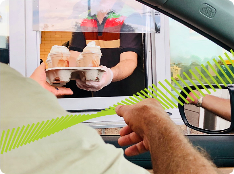 Man getting a milkshake at a drive-thru