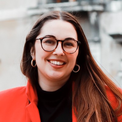 image of woman with glasses smiling