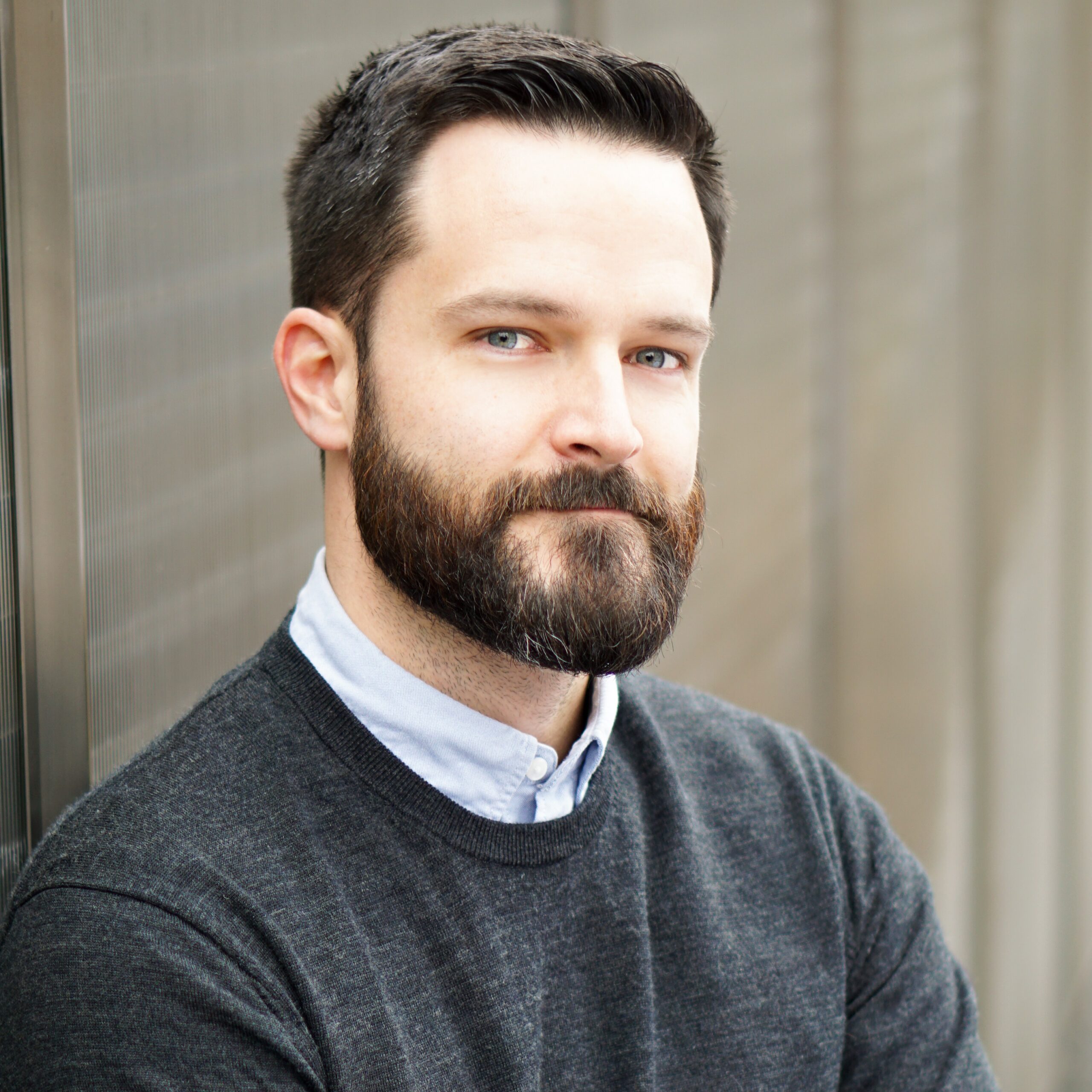 patrick lambert, man with dark hair and beard.