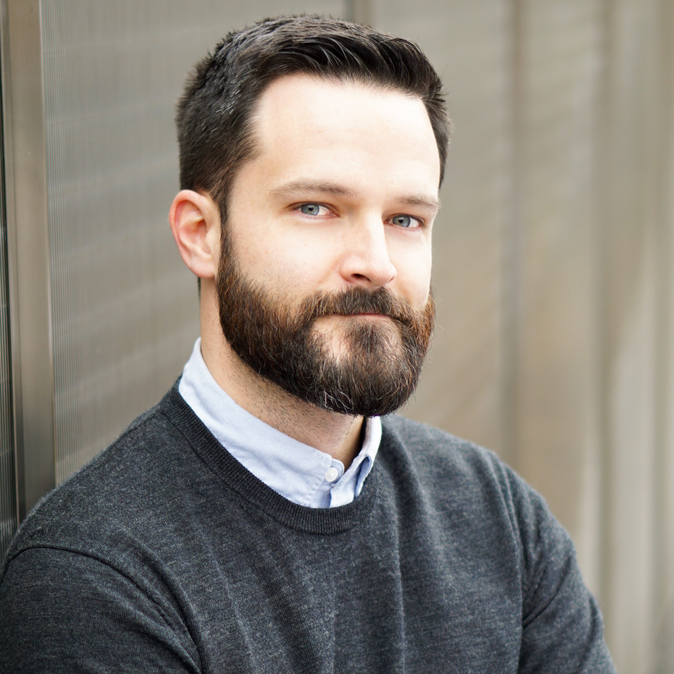 Patrick Lambert patrick lambert, man with dark hair and beard.